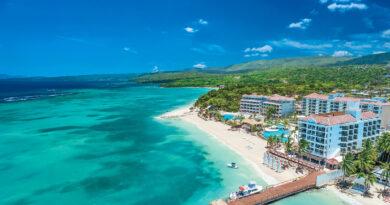 Fly into Jamaica's chic Sir Ian Fleming International Airport and indulge in luxury at Sandals Dunn's River, offering stunning views, fine dining, and rich James Bond history.