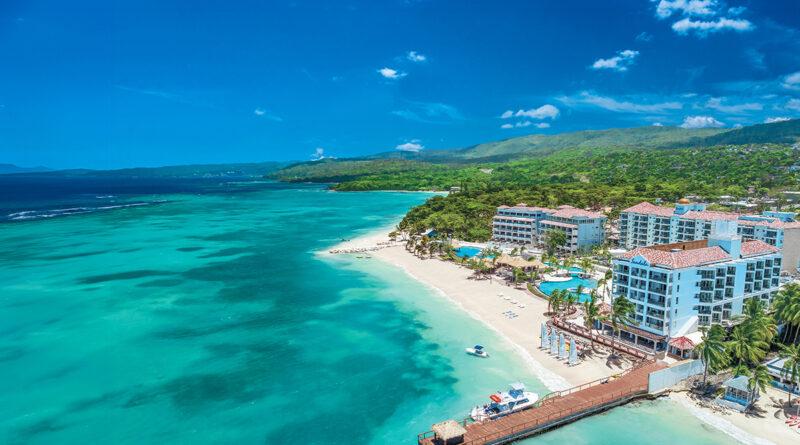Fly into Jamaica's chic Sir Ian Fleming International Airport and indulge in luxury at Sandals Dunn's River, offering stunning views, fine dining, and rich James Bond history.