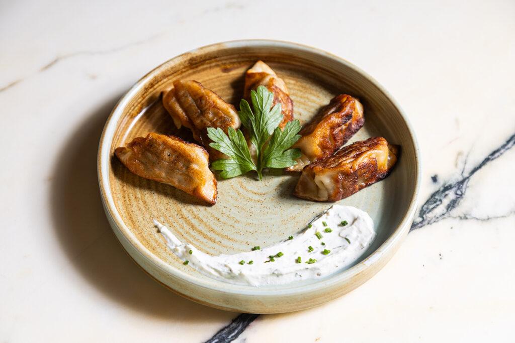 Experience the flavors of the Greek Islands at Almyra in Philadelphia, offering Mediterranean dishes, fresh seafood, and vibrant cocktails in a chic, airy setting near Rittenhouse Square.