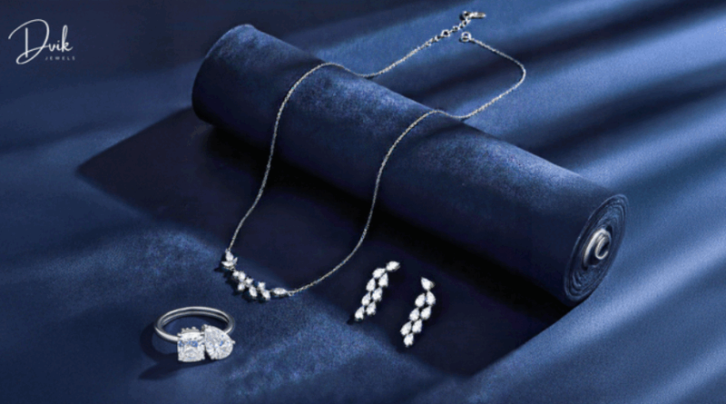 Diamond jewelry set with necklace, earrings, and ring displayed by Dvik Jewels]