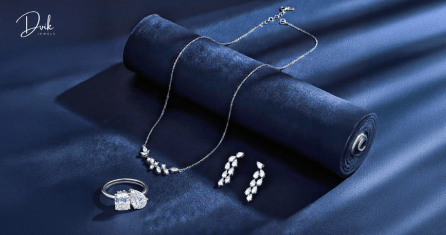 Diamond jewelry set with necklace, earrings, and ring displayed by Dvik Jewels]