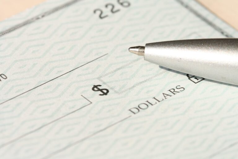 person filling out a personal check