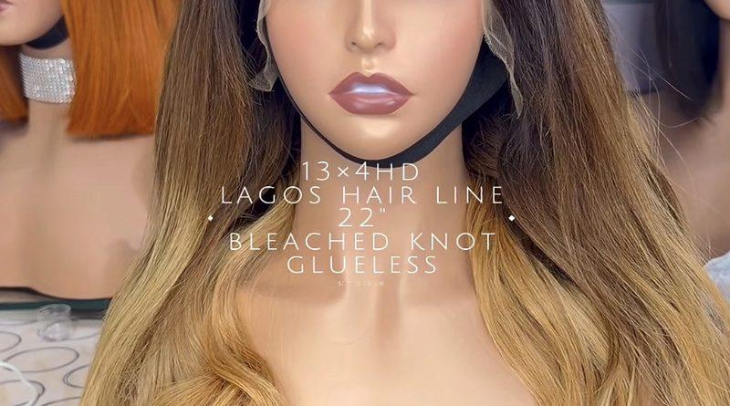 Real Vayora lace-front human hair wig product photograph; front view of brown-to-blonde body-wave style.